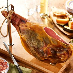 Bone in Jamon Serrano by Peregrino; Give this one to yourself! A beautiful centerpiece and the ultimate Spanish cuisine experience, this 16-18 pound jamon cured in the mountains for 18 months. Keep in your basement for a few more years and it'll just get more delicious! $249.95